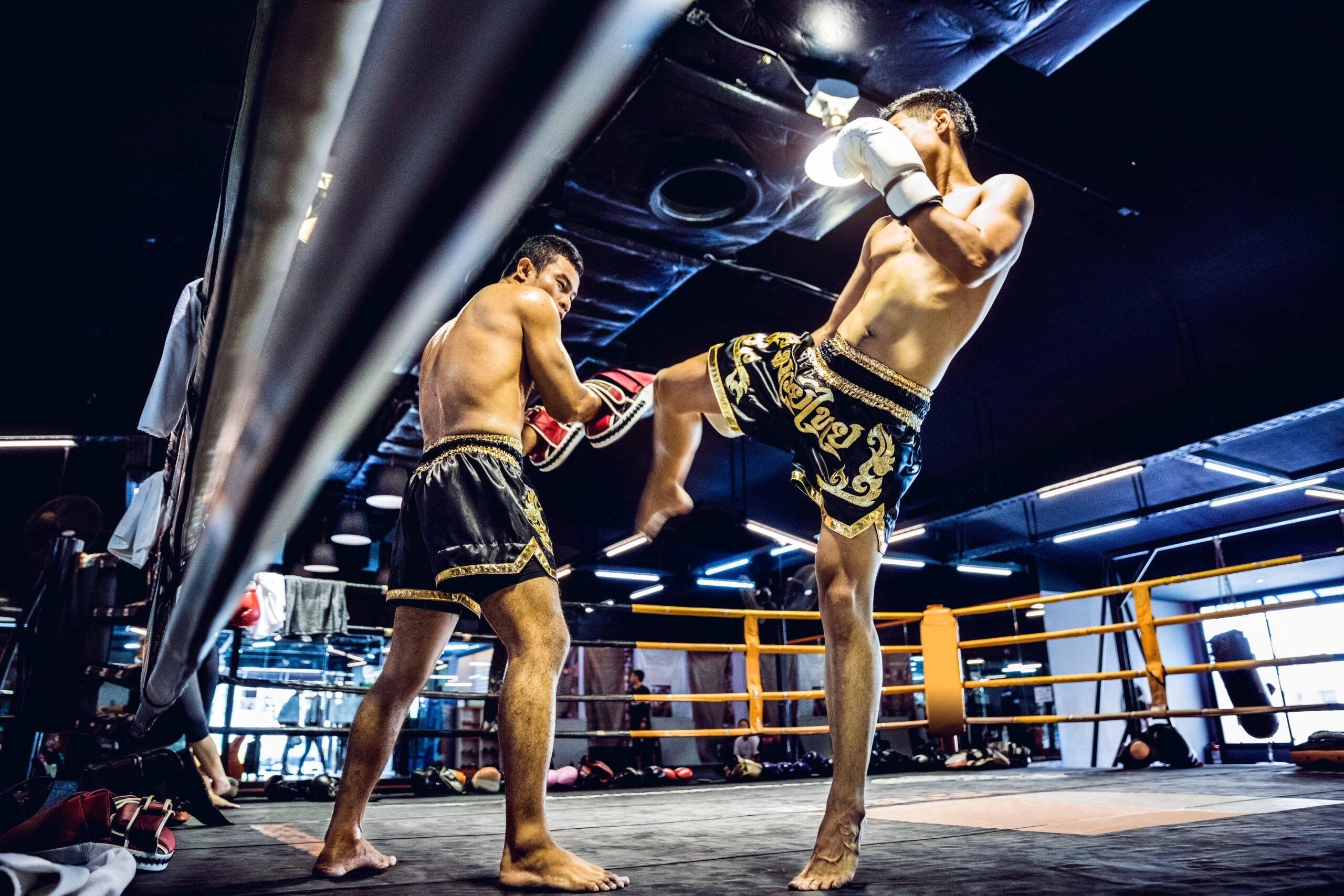 Muay Thai athletes training on the boxing ring